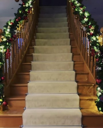 Peter's large staircase with a Christmas garland on each bannister