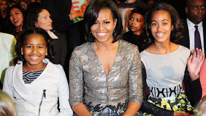 michelle obama sitting with daughters malia and sasha