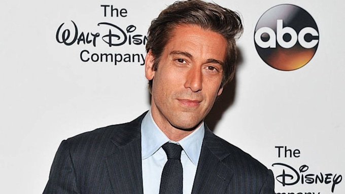 David Muir in black suit