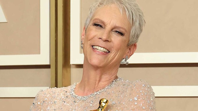 Jamie Lee Curtis smiling with her Oscar just in frame