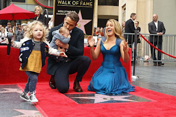 blake lively and ryan reynolds on the red carpet with their daughters