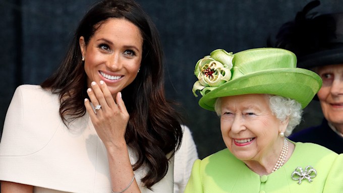 Meghan Markle smiles next to Queen Elizabeth II