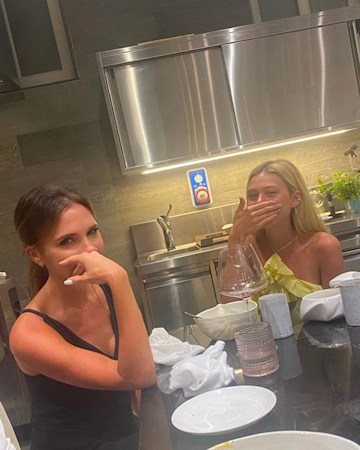 Victoria Beckham and Nicola Peltz in a kitchen