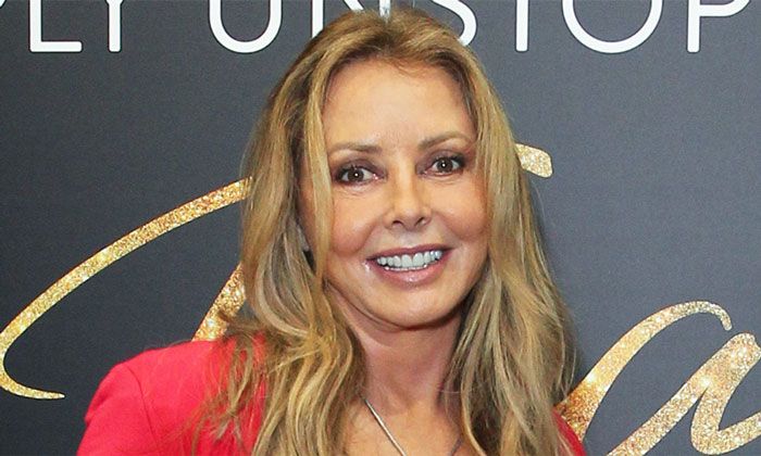 Carol Vorderman poses up a storm in fiery red gown for candid new post