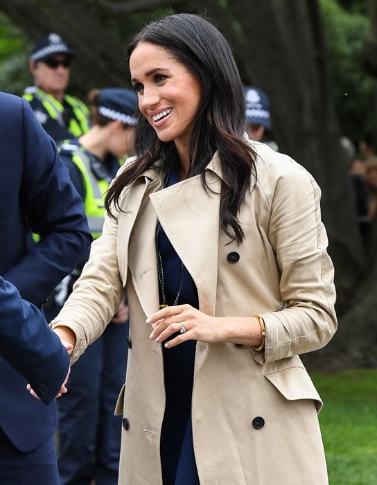 Meghan Markle cuts an elegant silhouette in £1.8k trench coat for ...