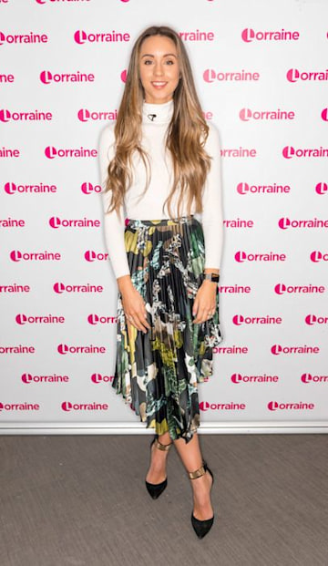 Peter Andre's wife Emily wows in statement midi skirt on Lorraine show ...