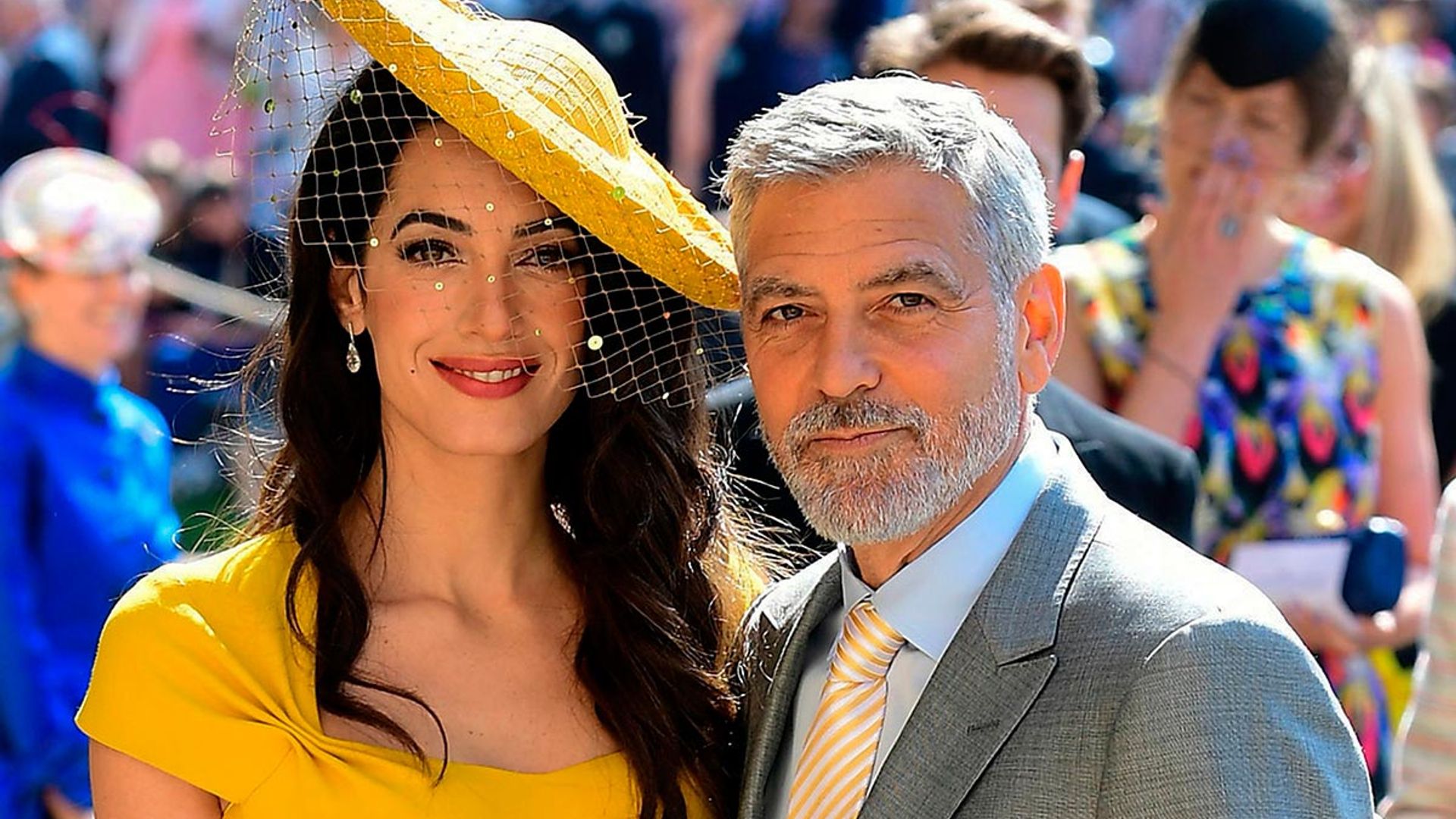 amal clooney yellow hat