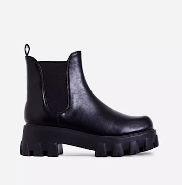 Victoria Beckham surprises in £685 chunky boots - instead of her usual ...