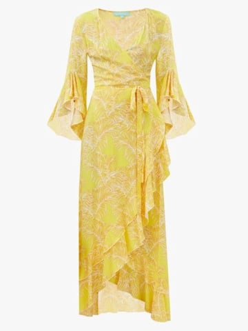 Amanda Holden stuns in plunging yellow beach dress as she strolls in