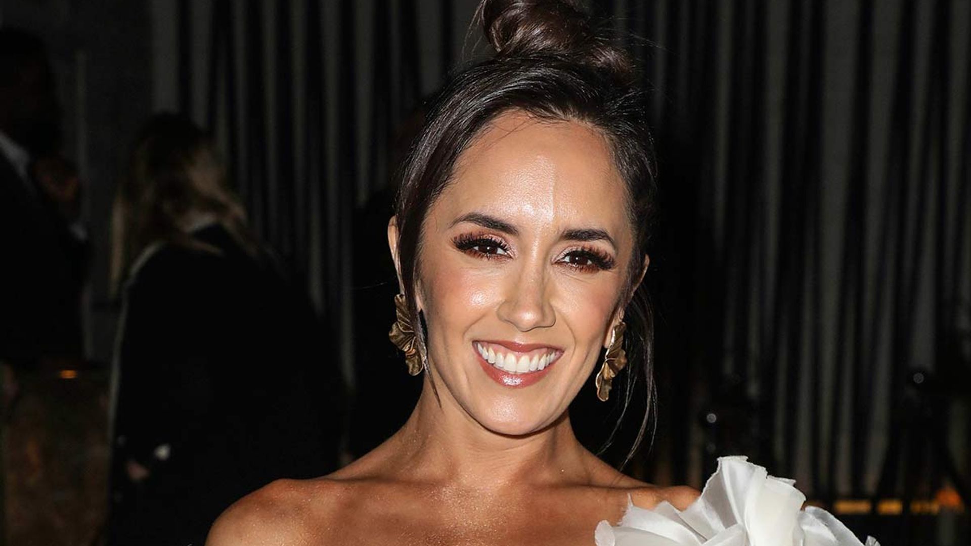 Manrara sizzles in figureenhancing gold dress for emotional