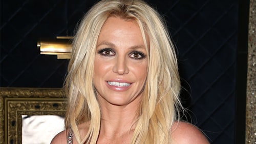 Britney Spears displays her amazing figure in plunging green dress