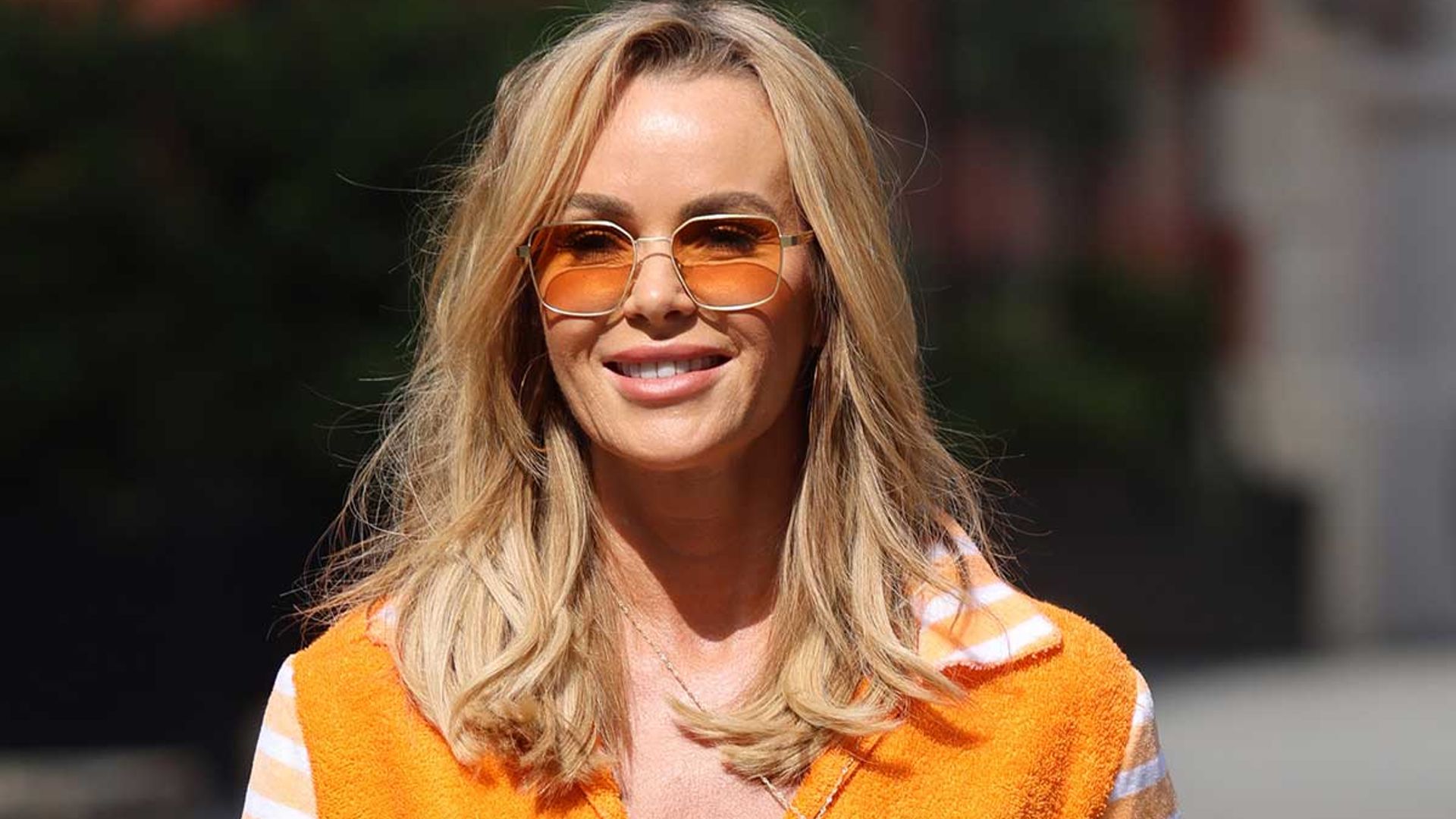 Amanda Holden looks impossibly youthful in crop top and figure-hugging