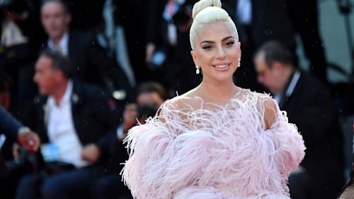 Lady Gaga channels her inner Vegas showgirl in a sheer dress with a daring slit