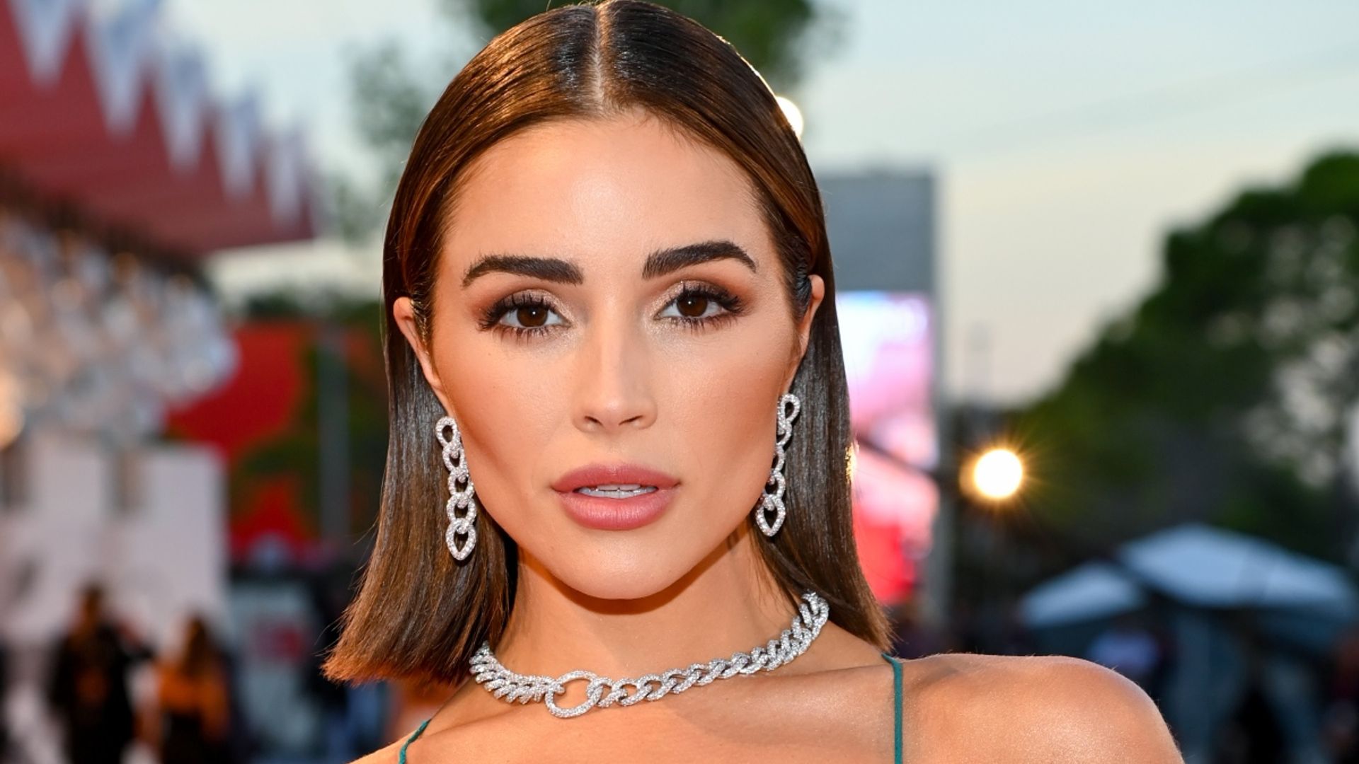 Olivia Culpo floors fans in skin-tight black ensemble with a high slit ...