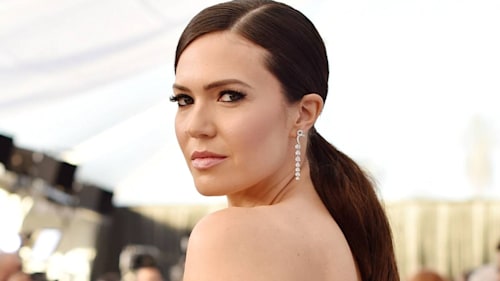 Mandy Moore looks sensational in chic satin dress as she poses by the pool