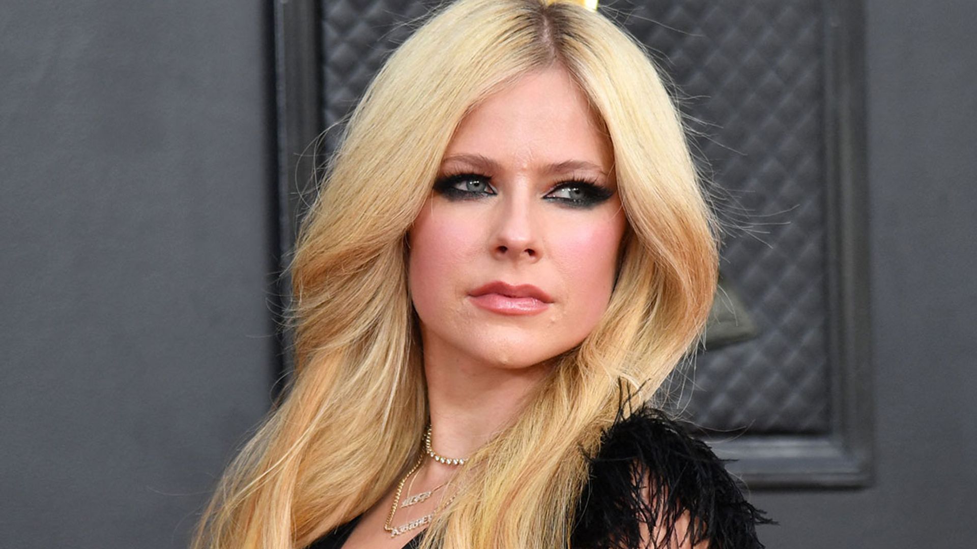 Avril Lavigne stuns in unexpected legbaring dress for Grammys comeback