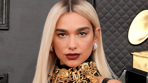 Dua Lipa amazes in slinky Versace bondage dress at Grammy Awards