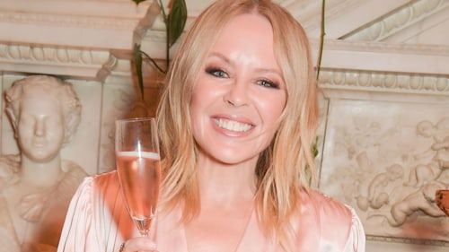 Kylie Minogue looks lovely in flirty pink satin dress on special occasion