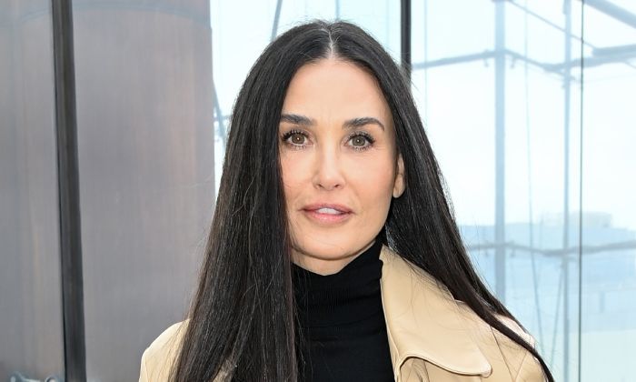 Demi Moore poses in a bathrobe with an adorable surprise