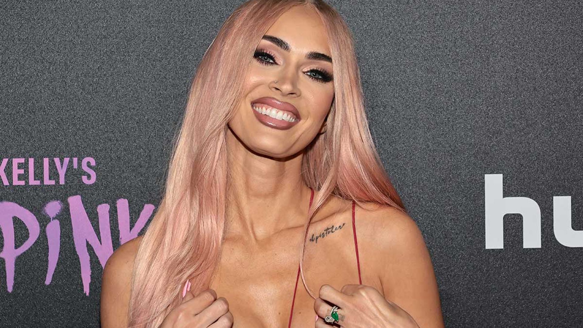 Megan Fox wows in revealing metallic pink outfit to support Machine Gun Kel...
