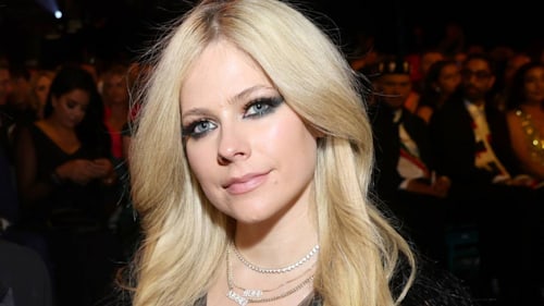 Avril Lavigne wows in mesh top and mini skirt during Machine Gun Kelly's tour