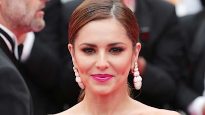 Cheryl is picture perfect in sleek crop top and playful maxi skirt