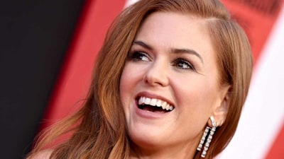 Isla Fisher channels movie magic in racy ruffled dress