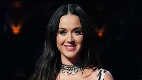 Katy Perry feels the heat in skin-tight leopard-print dress and fishnet tights