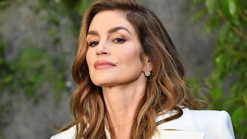 Cindy Crawford looks disco-ready in iridescent party dress