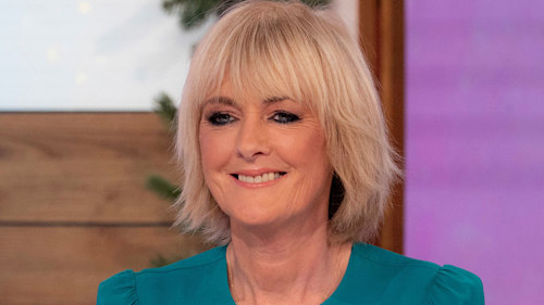 Jane Moore stuns in feathered party dress post marriage breakdown