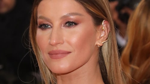 Gisele Bundchen looks fabulous in eye-catching metallic gown as she steps out at glitzy event