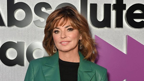 Shania Twain poses in a cone bra alongside an eagle for bold photoshoot