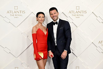 Michelle Keegan in red mini dress and Mark Wright in tuxedo