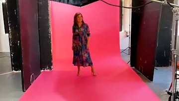 Lorraine Kelly in a flowing dress for a photo shoot
