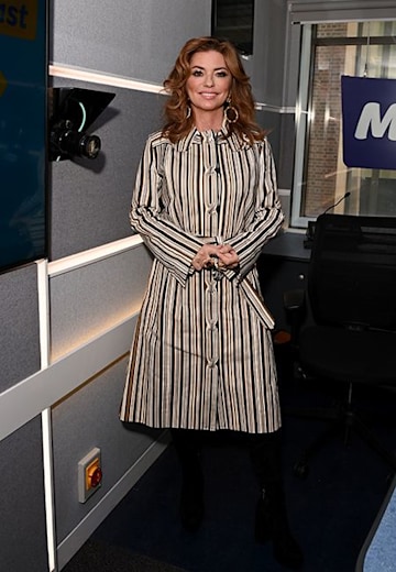 shania twainin a stripey dress