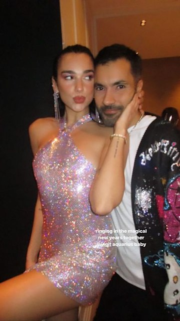 Dua Lipa poses with a friend