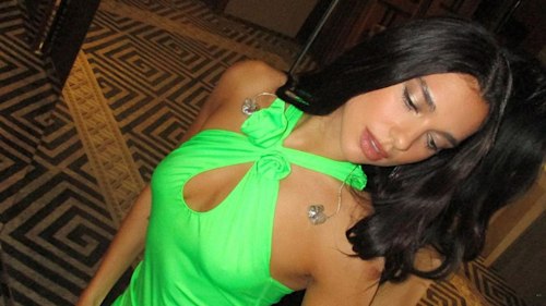 Dua Lipa surprises fans in a neon green halter dress