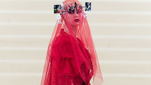 Katy Perry stuns at the Met Gala in blaring red John Galliano gown