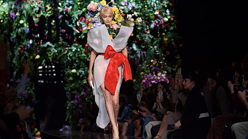 Gigi Hadid dresses as a bouquet for extraordinary Moschino show