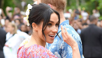 Meghan Markle dresses her bump in bold pom-pom maxi dress as she greets