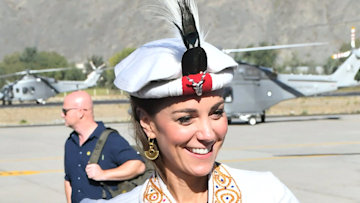 Kate Middleton wearing the traditional hat.
