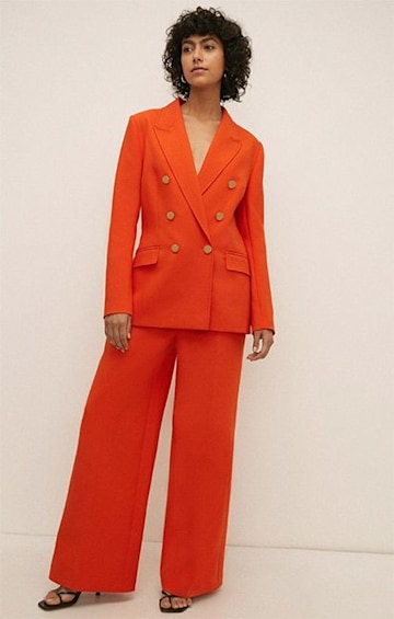 oasis-orange-suit