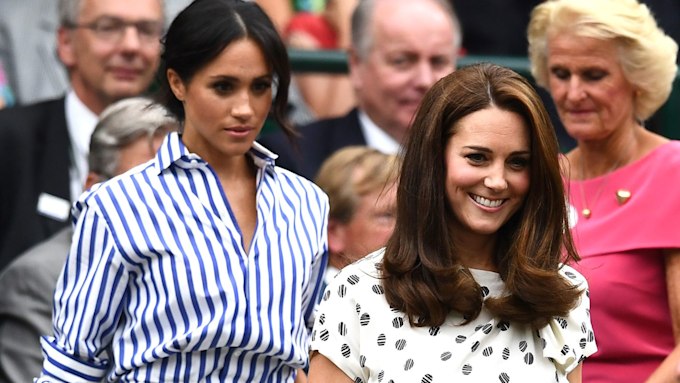 Meghan, Duchess of Sussex and Catherine, Duchess of Cambridge attend day twelve of the Wimbledon Lawn Tennis Championships at All England Lawn Tennis and Croquet Club on July 14, 2018