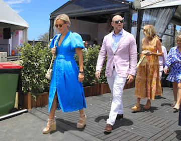 Zara Tindall wears a blue puff-sleeved dress