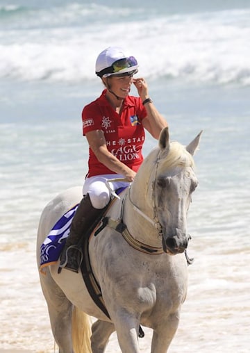 Zara Tindall rides a white horse