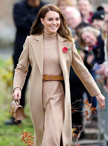 kate middleton wearing a camel coat and a tan belt