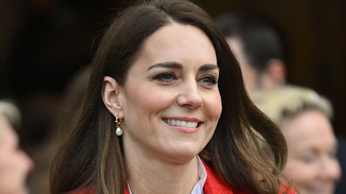 Princess Kate beams in a red jacket and pie crust blouse