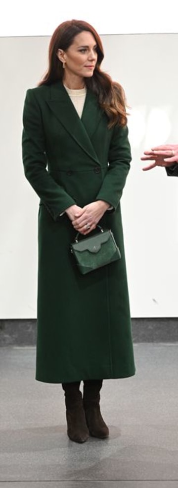 kate middleton wearing green coat and laughing