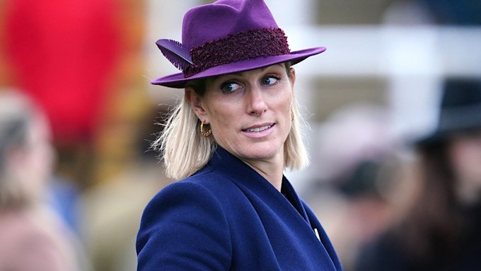 zara tindally in a purple hat