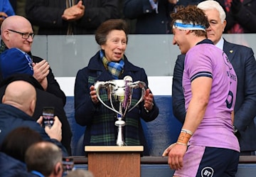 princess anne at the rugby in a navy coat